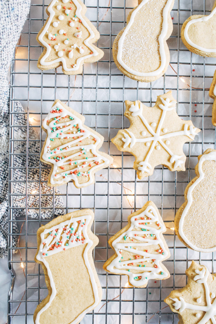 Vegan and Gluten-free Sugar Cookies- made with buttery almond flour, these cookies have crisp edges and a delicious chewy center. They're super simple to make and no one would ever guess they are made with healthier ingredients!