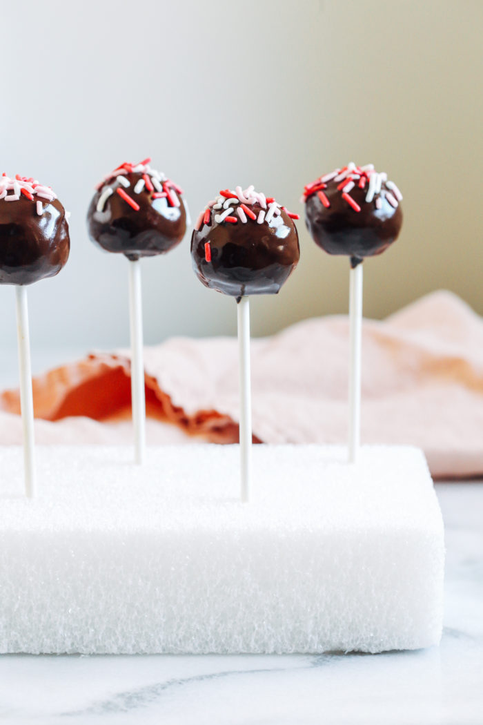 Grain-free Double Chocolate Cake Pops- Made with a simple and wholesome paleo chocolate cake mix, these moist and decadent cake pops are the perfect treat to share with someone you love!