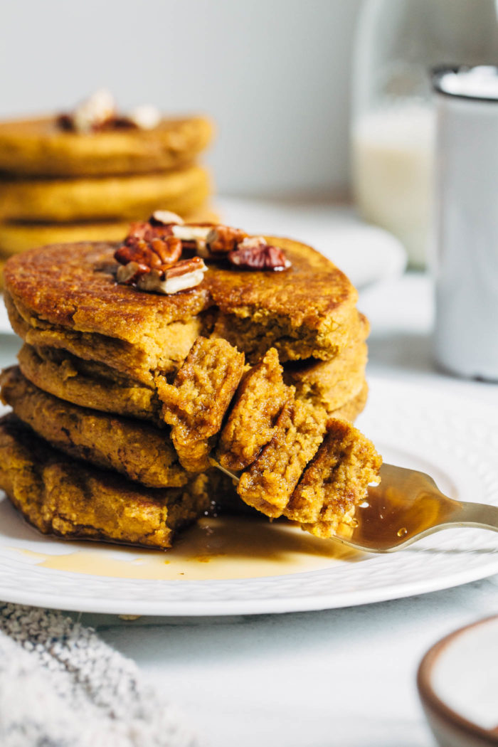 Vegan Gluten-free Pumpkin Pancakes- Made with wholesome ingredients, these pancakes come together fast in the blender and are full of delicious pumpkin flavor.