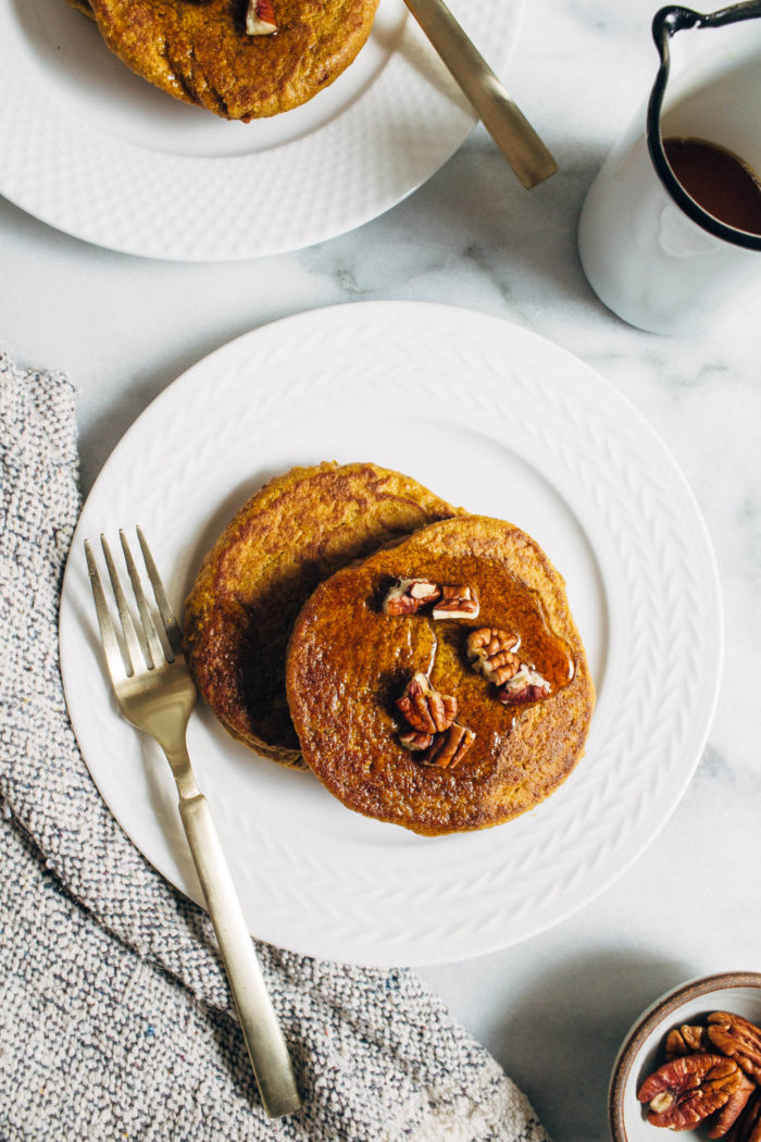 Vegan Gluten-free Pumpkin Pancakes- Made with wholesome ingredients, these pancakes come together fast in the blender and are full of delicious pumpkin flavor.