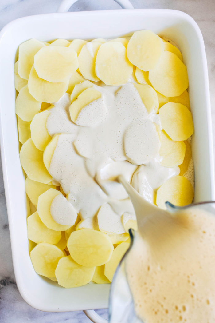 Easy Vegan Scalloped Potatoes- made with just 8 ingredients, this recipe for dairy-free scalloped potatoes is so much easier than the traditional version yet just as creamy and delicious! 