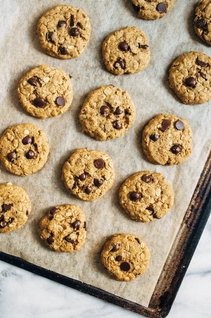 Vegan Oatmeal Chocolate Chip Cookies- made in one bowl, these chewy cookies have crisp edges and a soft center. No one would ever guess they are vegan and gluten-free!