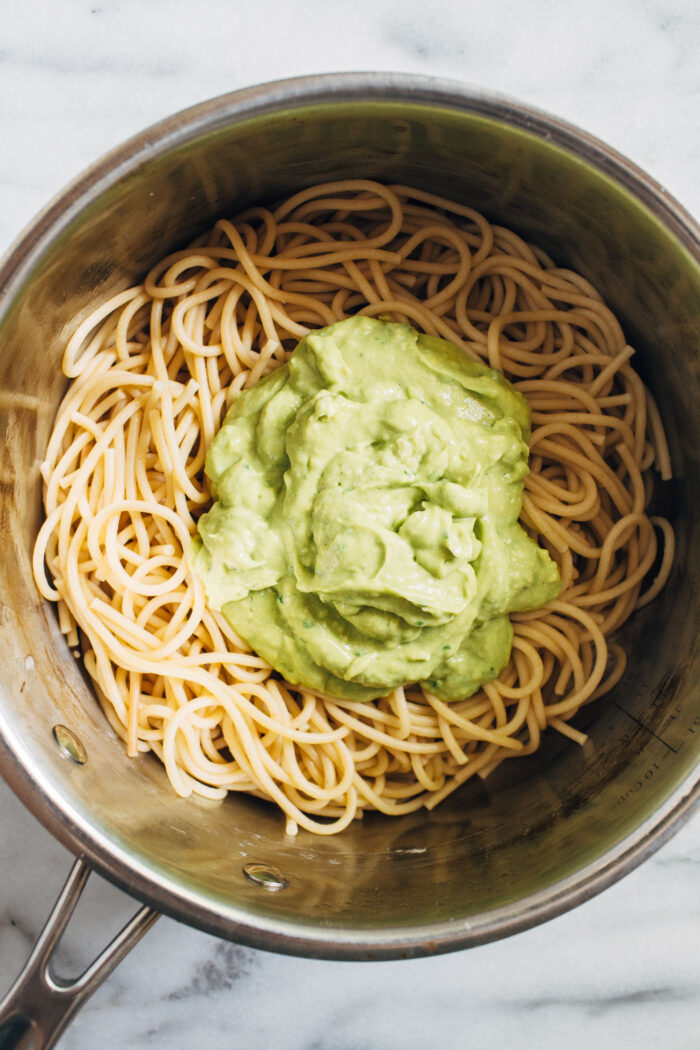 Easy Avocado Pesto Pasta- Made with minimal ingredients, this avocado pesto is a delicious way to sneak in healthy fats and it takes less than 30 minutes to make!