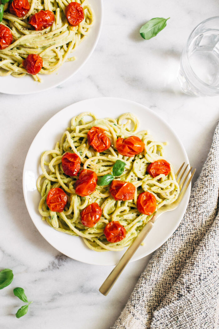 Easy Avocado Pesto Pasta- Made with minimal ingredients, this avocado pesto is a delicious way to sneak in healthy fats and it takes less than 30 minutes to make!