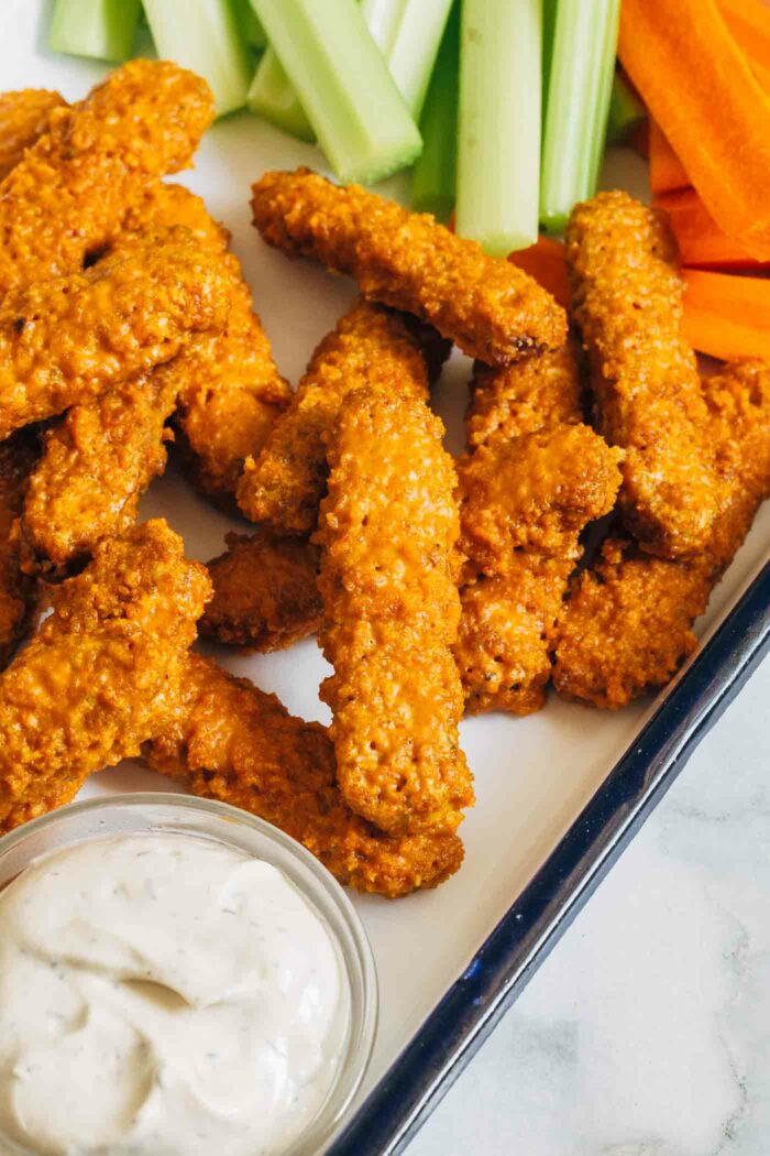 Baked Buffalo Tempeh Wings- easy to make and packed with flavor, these tempeh wings make for the perfect plant-based appetizer or lunch! (soy-free and gluten-free option)
