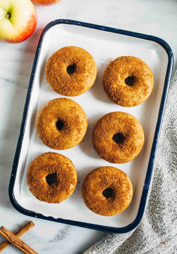 Baked Vegan Apple Cider Donuts- Easy to make and with the perfect fluffy texture, this autumn-inspired recipe is sure to satisfy your craving for apple cider donuts!
