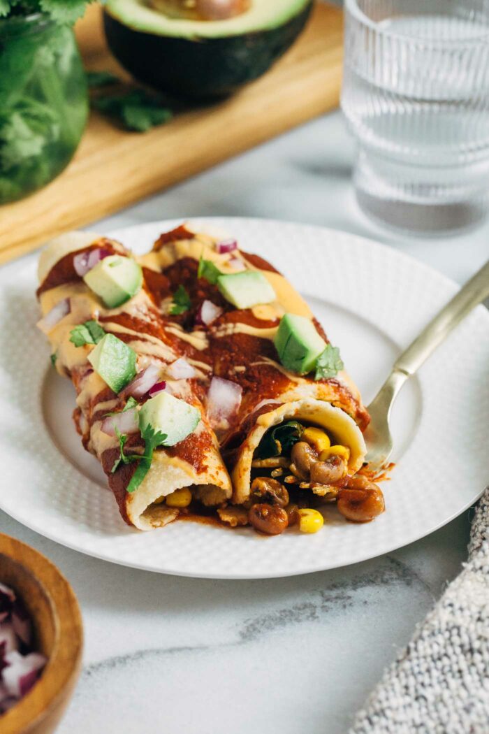 Lucky Enchiladas- made with black eyed peas and kale, these vegan enchiladas are easy to make and packed with flavor!