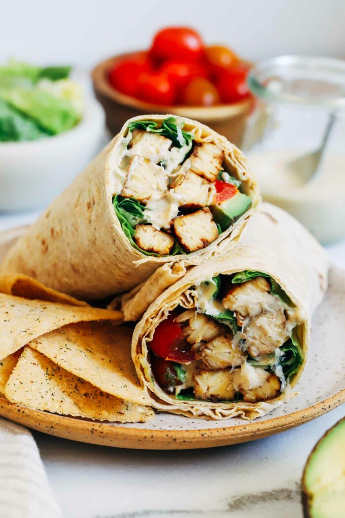 Vegan Tempeh Caesar Salad Wraps- Made with savory tempeh, crunchy romaine and the BEST vegan caesar salad dressing. Each wraps offers over 30g of protein!