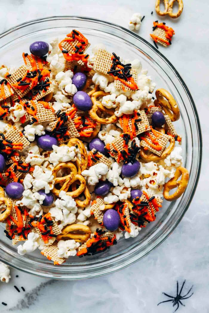 Easy Halloween Snack Mix- loaded with sweet and salty treats, this healthier snack mix is easy to prepare and perfect for parties or movie nights at home! (vegan + gluten-free option)