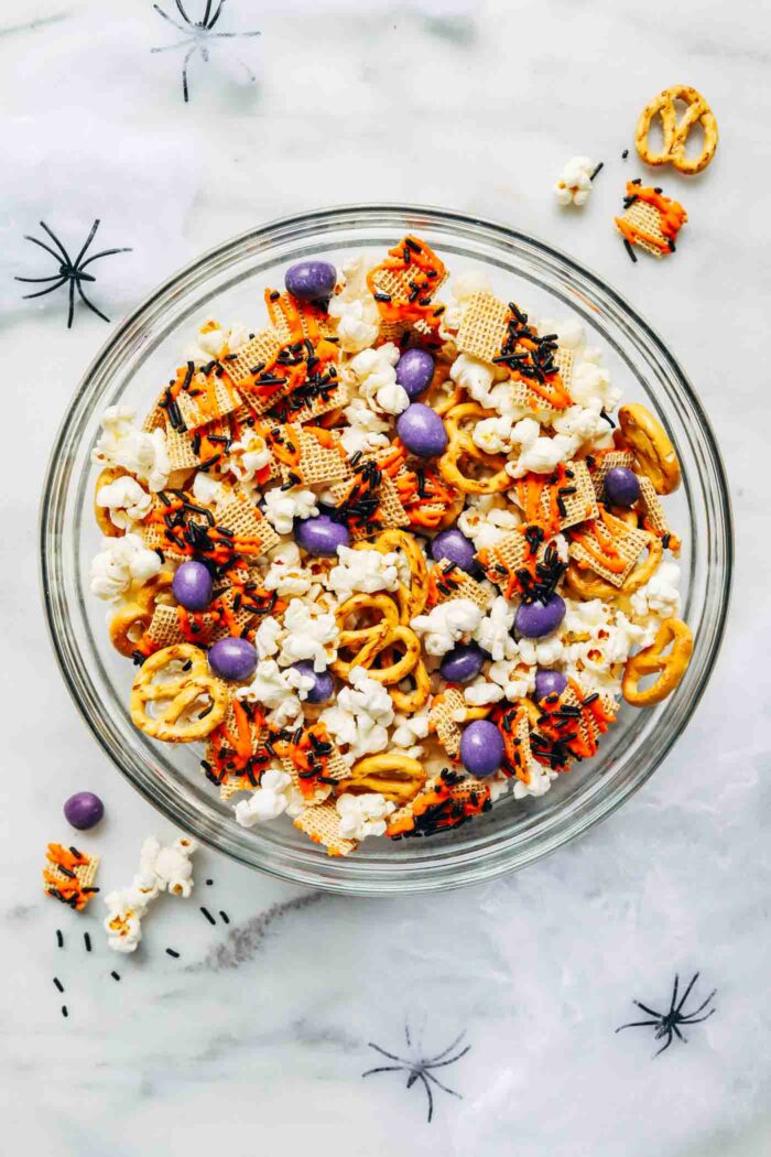 Easy Halloween Snack Mix- loaded with sweet and salty treats, this healthier snack mix is easy to prepare and perfect for parties or movie nights at home! (vegan + gluten-free option)