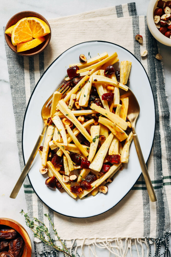 Honey Roasted Parsnips with Dates and Hazelnuts- Crisp parsnips baked in a simple glaze of olive oil, honey and orange zest. The addition of warm dates and buttery roasted hazelnuts makes for combination that will make this side dish the star of the show. (gluten-free)