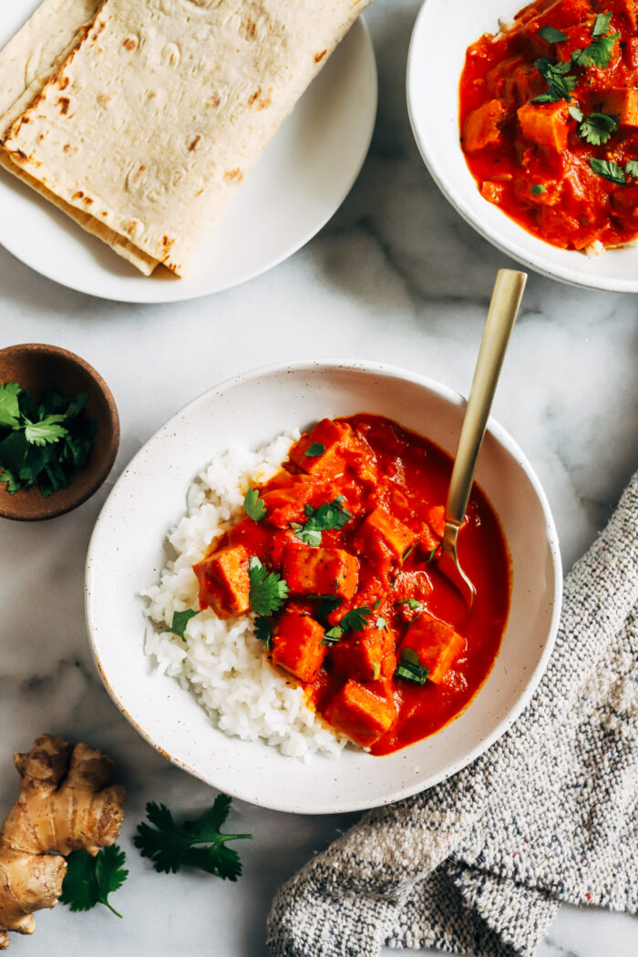 Vegan Butter Tofu- made with a creamy tomato sauce and baked tofu, this comforting meal provides 23g of complete protein per serving! (gluten-free)