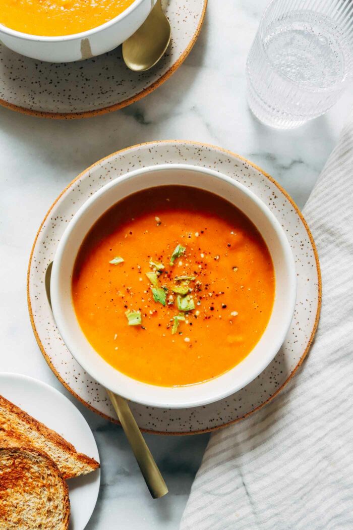 Vegan Red Lentil Tomato Soup- Cozy and full of flavor, this lentil soup is simple and easy to make. Each serving packs 11g of protein! 