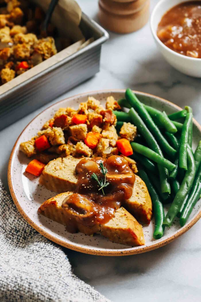 Easy Vegan 'Turkey' Roast- easy to make and perfect to prep in advance for the holidays, this vegan turkey roast packs 12 grams of protein per slice! (gluten-free + soy-free option)