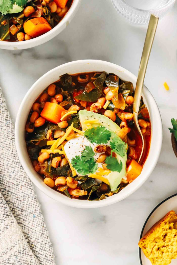 Black Eyed Pea Sweet Potato Chili- made in one-pot, this hearty plant-based chili is the perfect way to get your peas and greens for the New Year! (vegan, gluten-free)