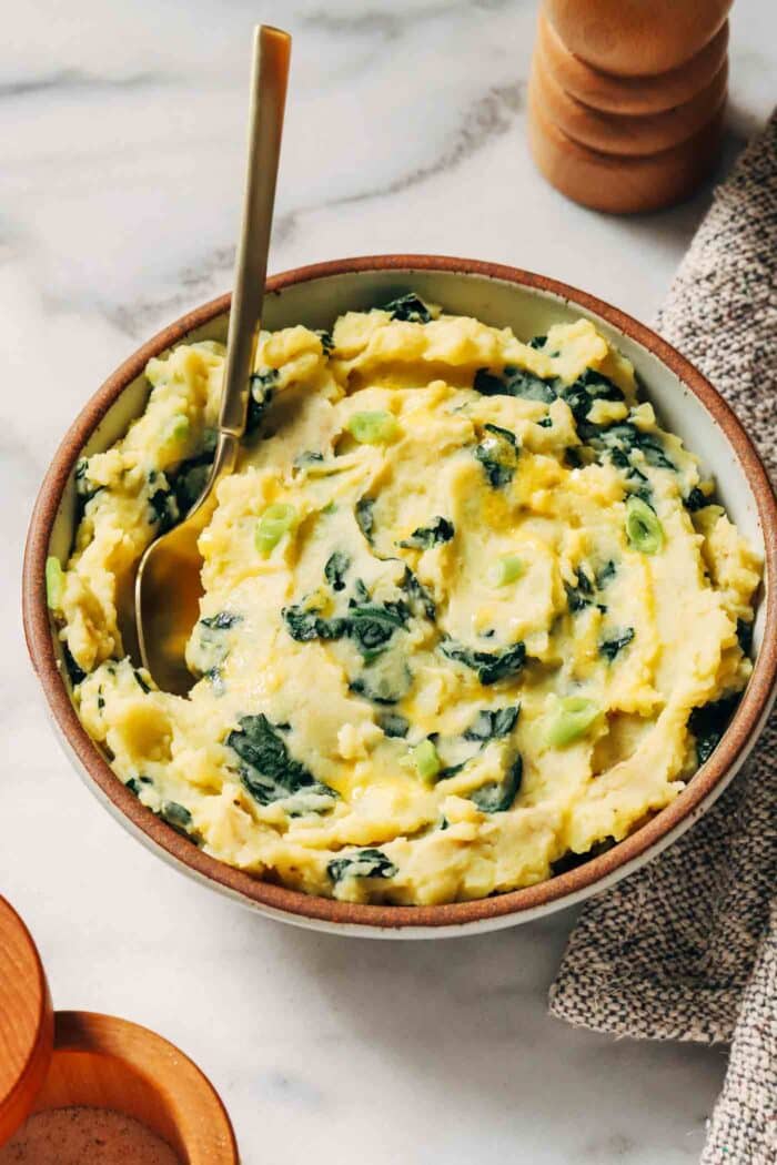 Vegan Colcannon- a plant-based take on an Irish classic featuring creamy mashed potatoes paired with sautéed kale and green onions. 