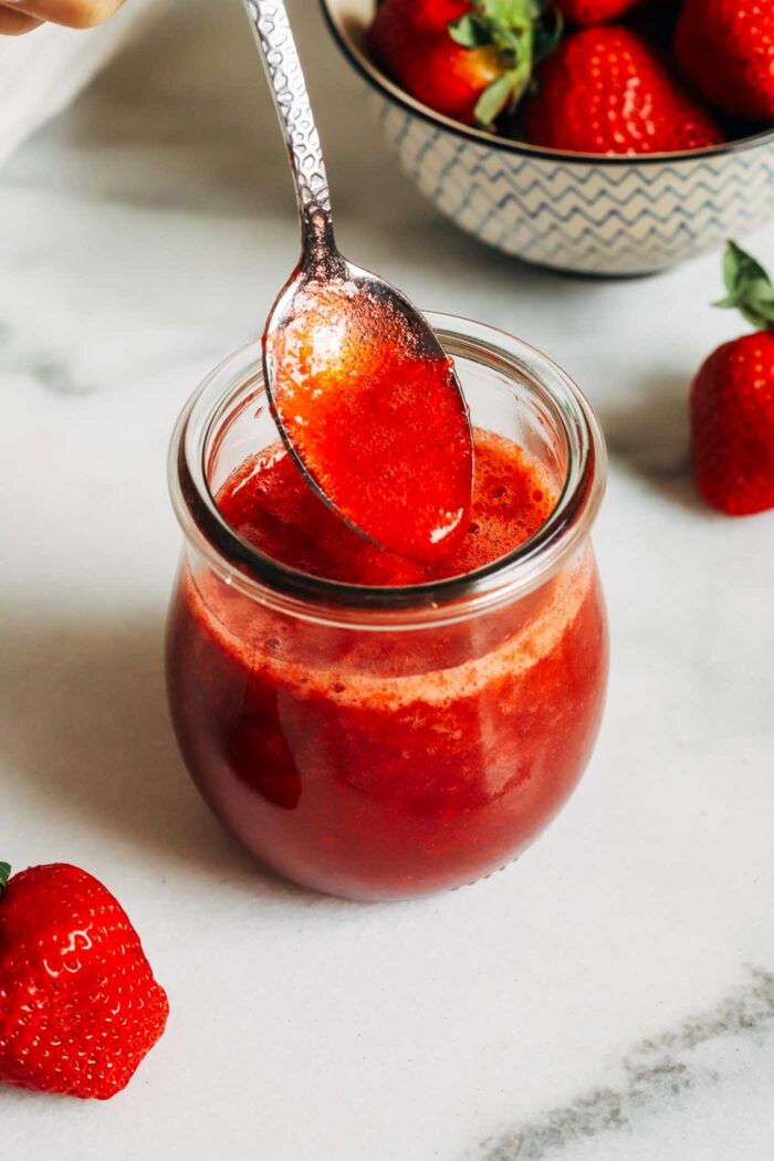 Made with just 3 ingredients, this strawberry syrup is naturally sweetened and refined sugar-free. Perfect for topping yogurt, oatmeal, pancakes, waffles, desserts and more! 