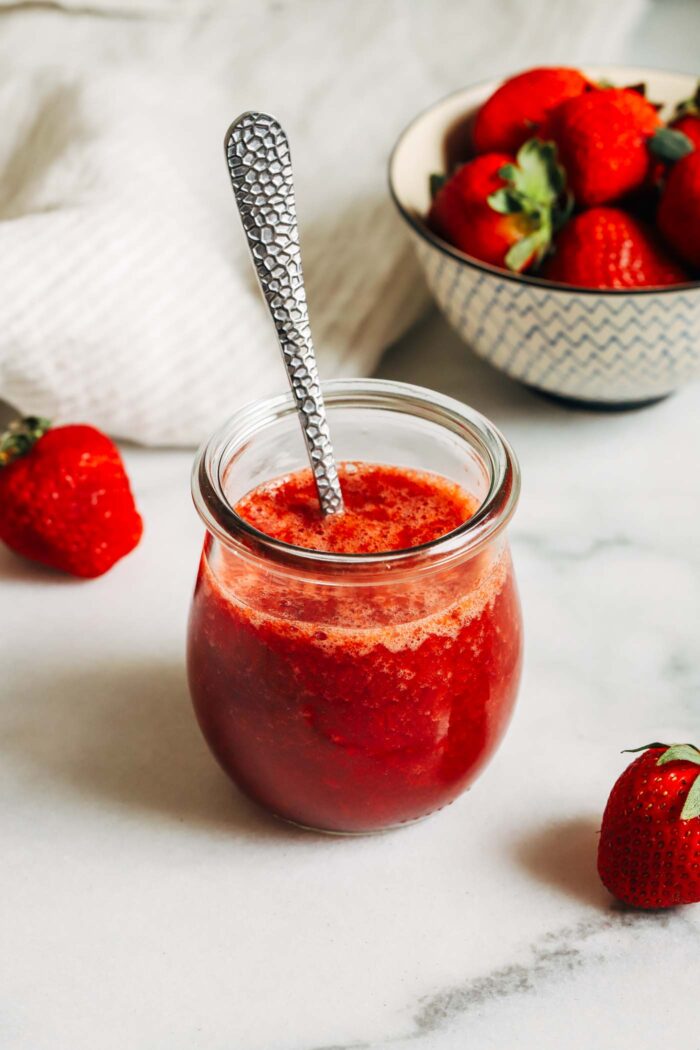 Made with just 3 ingredients, this strawberry syrup is naturally sweetened and refined sugar-free. Perfect for topping yogurt, oatmeal, pancakes, waffles, desserts and more! 
