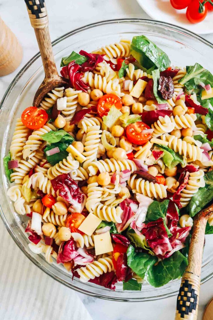 Italian Chopped Pasta Salad- Packed with vibrant crisp vegetables and delicious briny flavor, this Italian pasta salad is the perfect summertime meal. It only takes 30 minutes to make and holds up for several days, making it great to prep for healthy lunches or gatherings! (vegan + gluten-free)