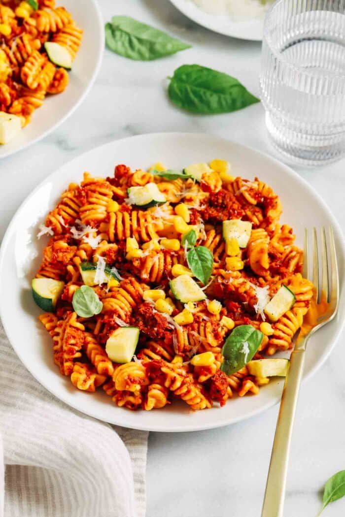 Ready in just 30 minutes, this sundried tomato pesto pasta is bursting with umami flavor. Perfect for a quick and easy summer dinner! (vegan + gluten-free)