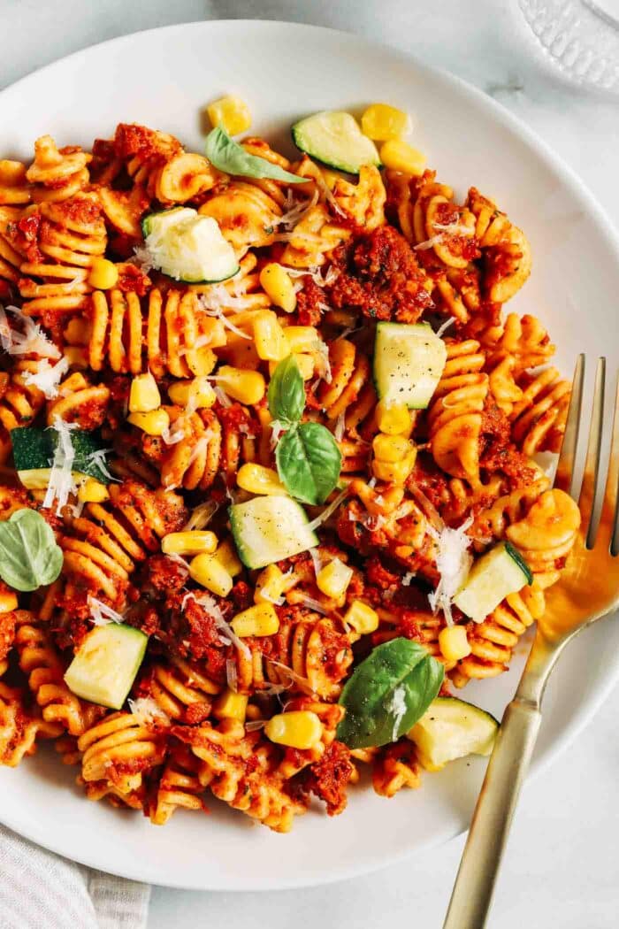Ready in just 30 minutes, this sundried tomato pesto pasta is bursting with umami flavor. Perfect for a quick and easy summer dinner! (vegan + gluten-free)