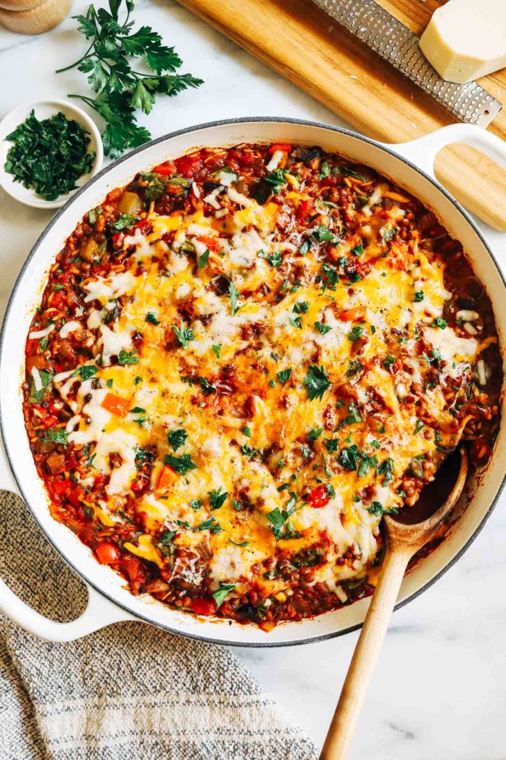 Lentil Stuffed Pepper Skillet- Made in one-pot, this vegan version of a stuffed pepper skillet is easy to prep and packs 23 grams of protein and 21 grams of fiber per serving!